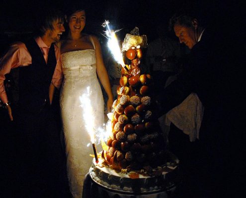 Bride and groom enjoying wedding cake