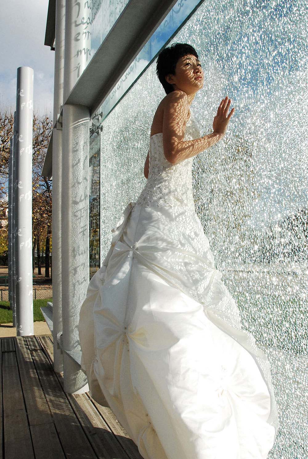 Weddings in and Around Paris 3 Bride in white dress in front of Peace Memorial monument, Paris, France