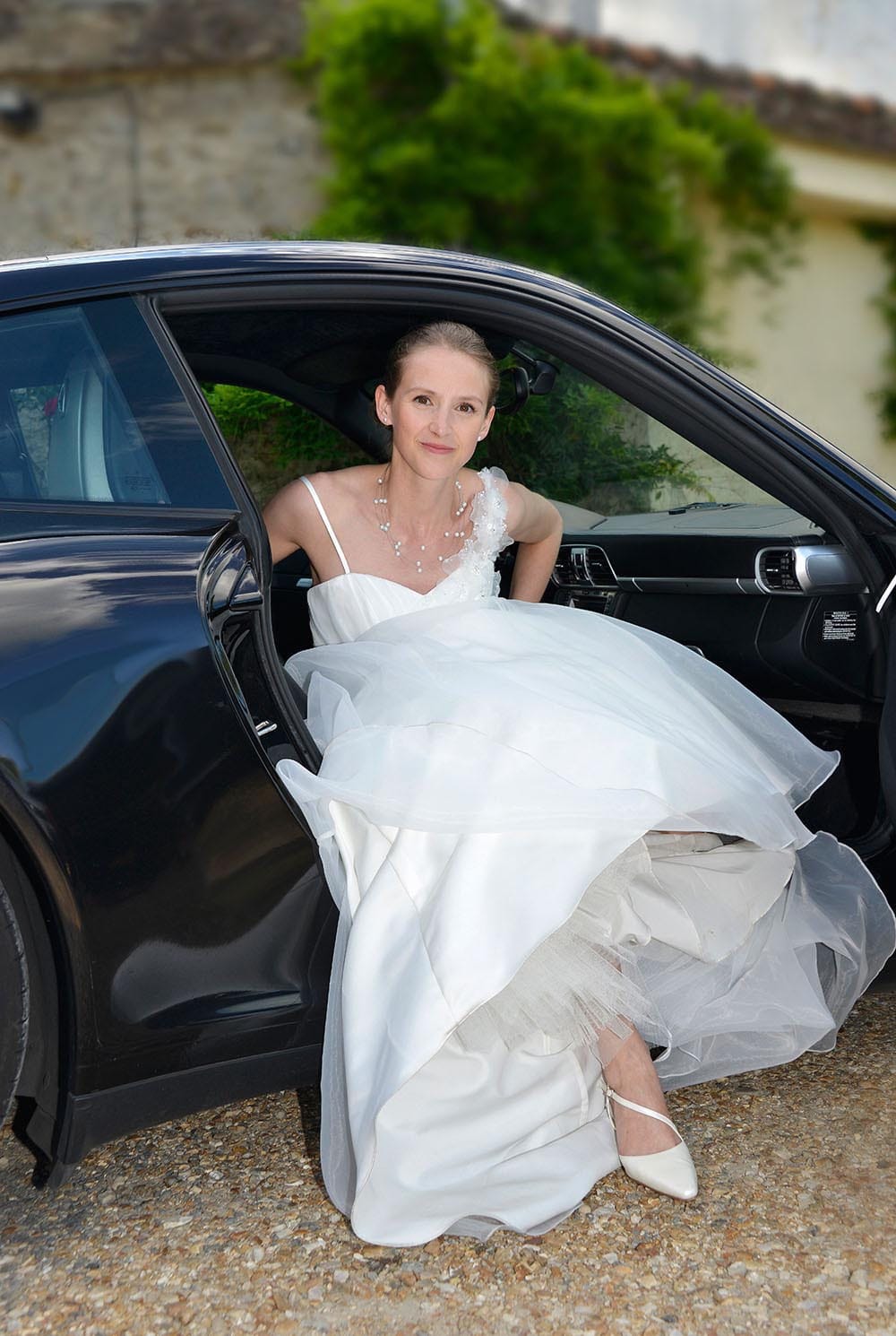 Weddings in and Around Paris 73 Bride in wedding dress, getting out of car