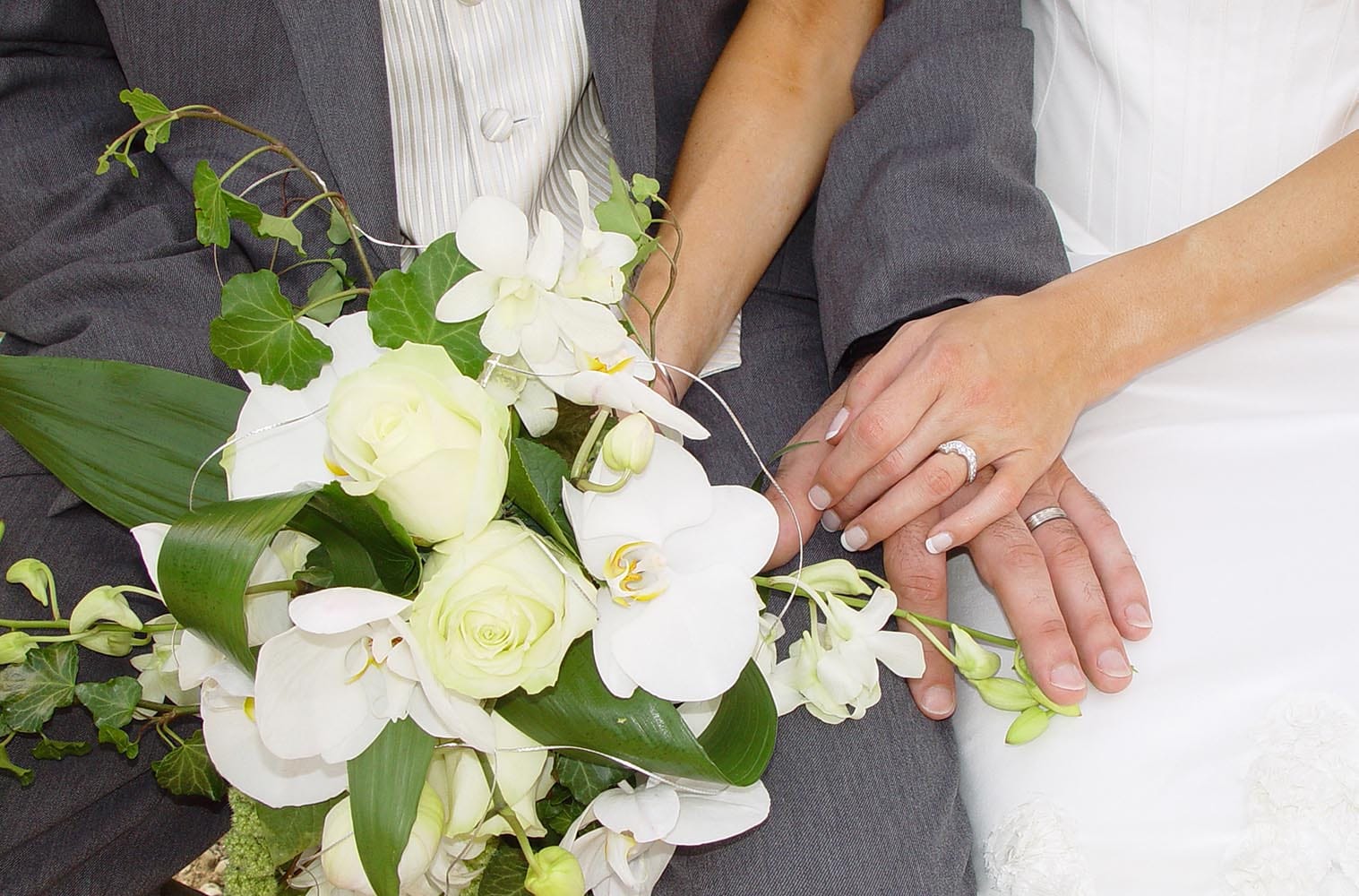Weddings in and Around Paris 65 Wedding bouquet with bride and groom hands with rings