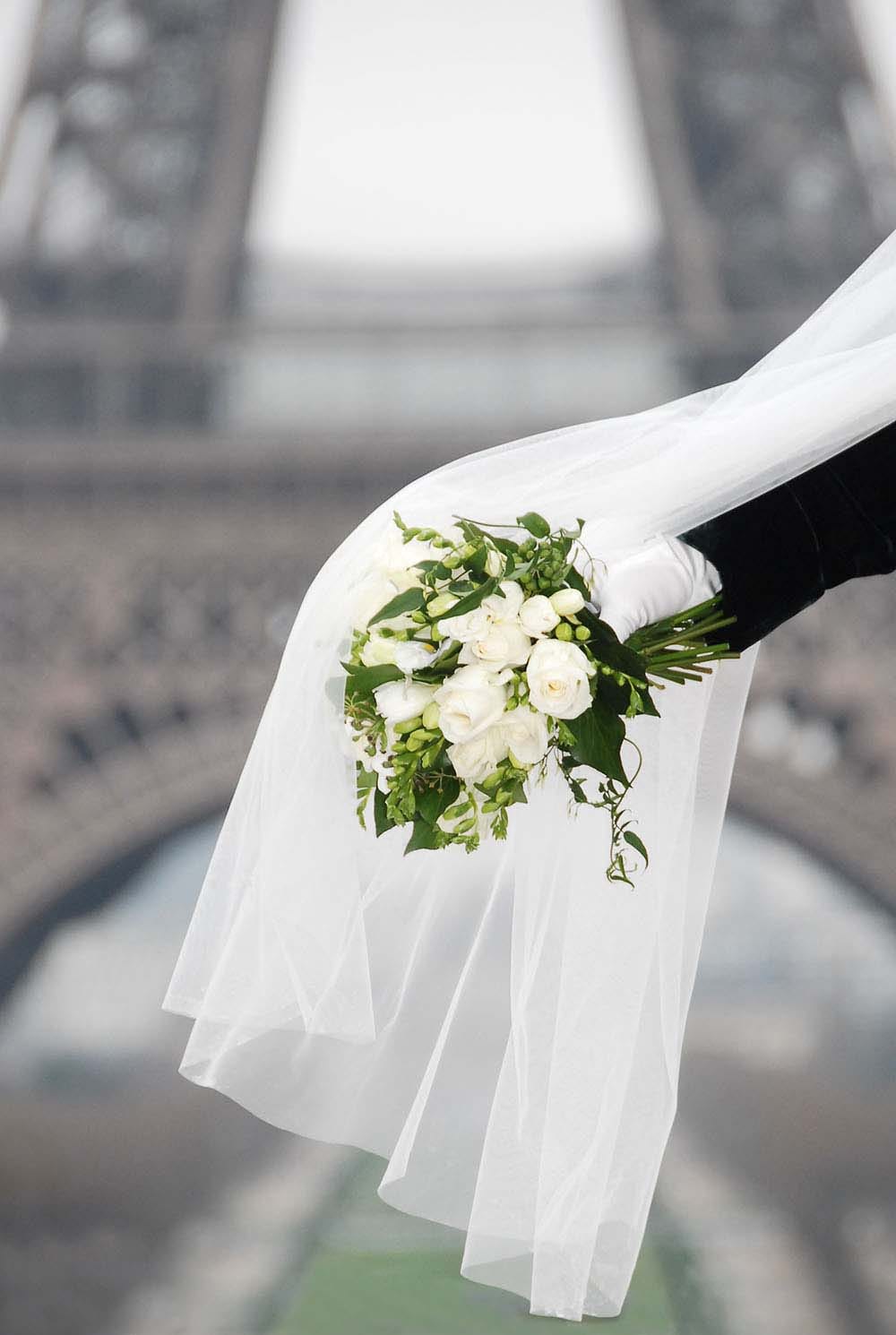 Weddings in and Around Paris 13 Detail of wedding bouquet with veil with Eiffel Tower backdrop, Paris, France