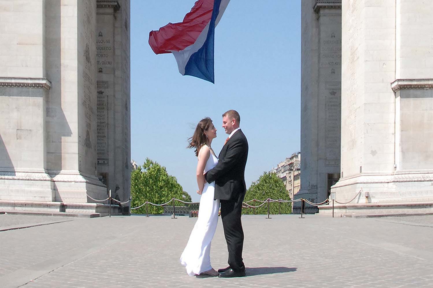 Weddings in and Around Paris 15 Wedding Couple in front of the Arc de Triomphe, Champs Elysees, Paris, France