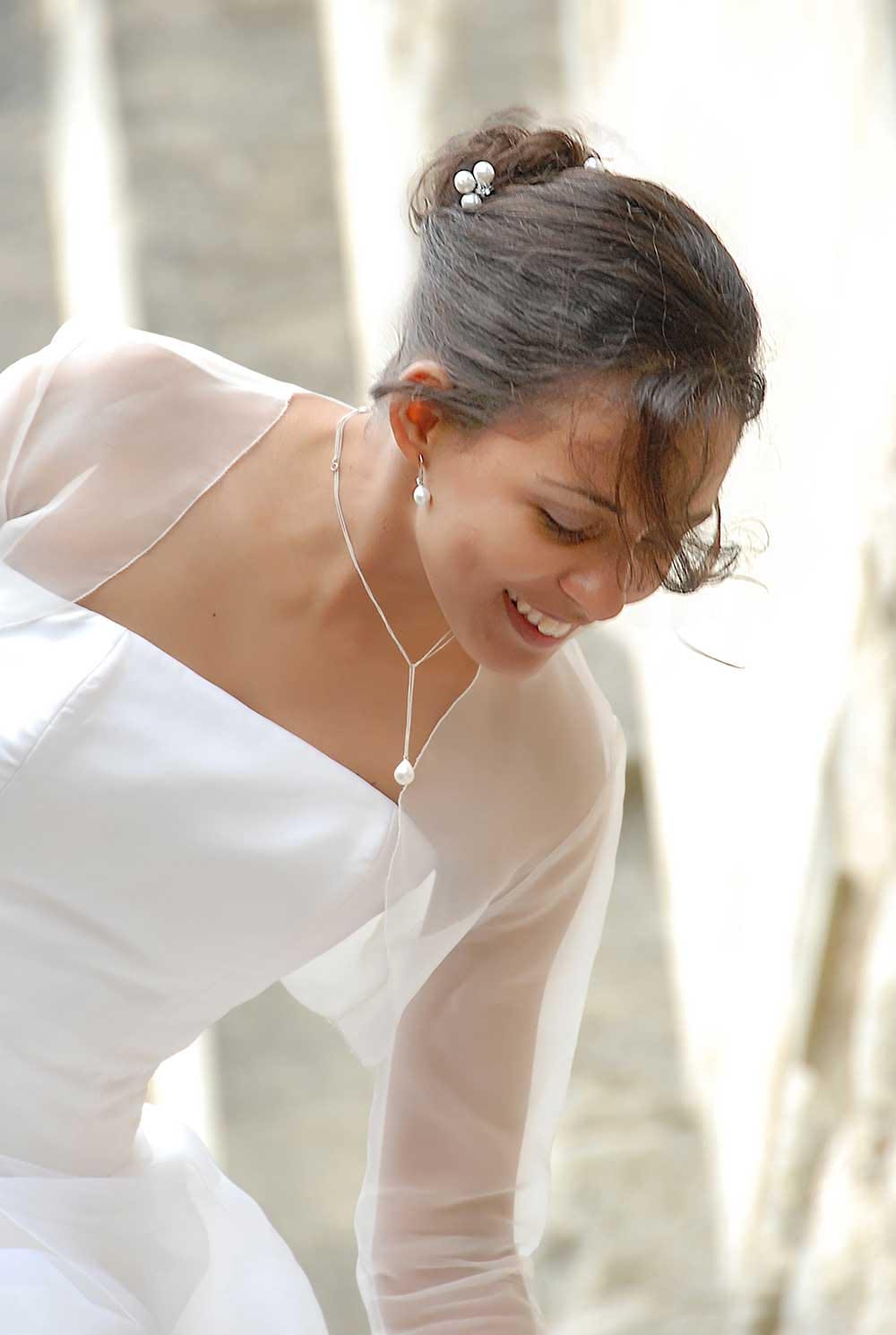 Weddings in and Around Paris 77 Bride in wedding dress with pearl necklace