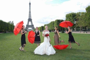 wedding bride guests red umbrellas eiffel tower gardens paris france