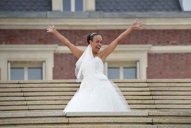 bride wedding dress showing happiness hands up